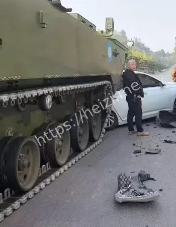 白色轿车硬刚装甲车